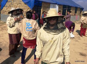 Nepalese women in beekeeping jackets